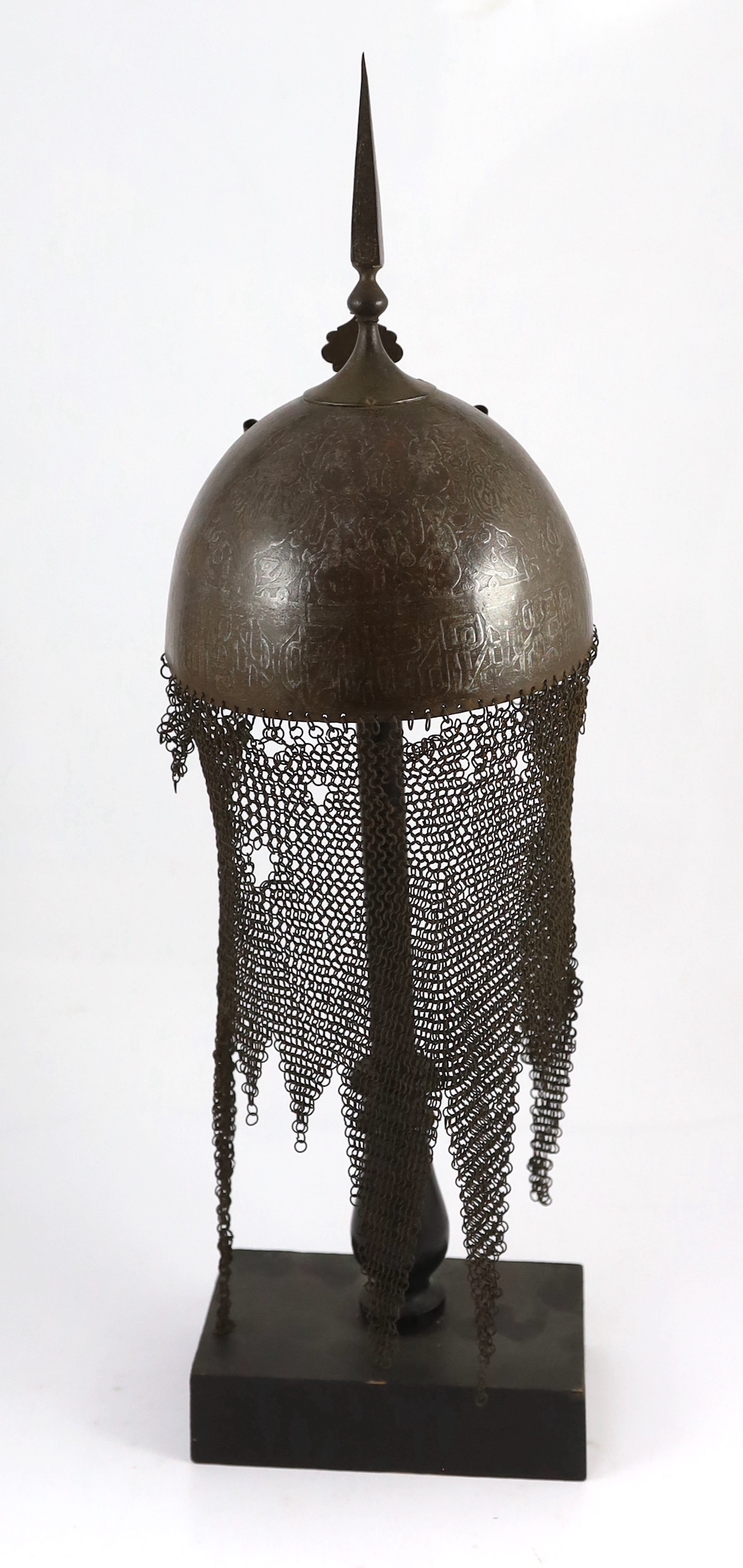 A 19th century Persian Kulah Khud, overall 60cm high, on ebonised stand including a section of human skull